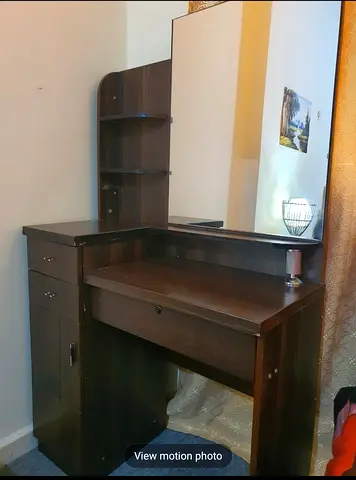 Dark wood dresser with large mirror and shelves - good condition
