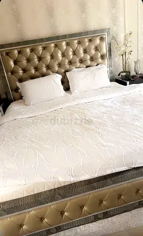King-size tufted leatherette bed frame with padded headboard (like new)