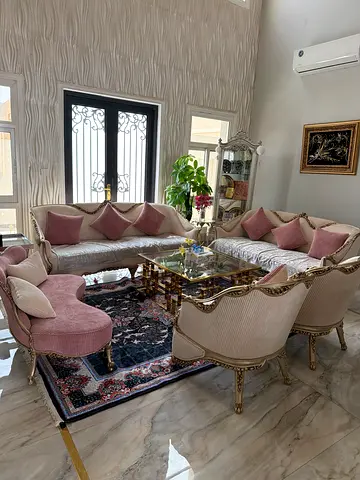 Classic cream and pink upholstered living room sofa set with coffee table