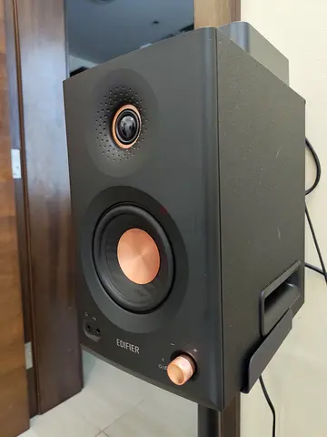 Edifier bookshelf speaker pair (black with copper drivers) - excellent condition. In original box