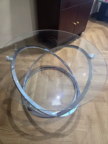 Glass round coffee table with chrome interlocking ring base