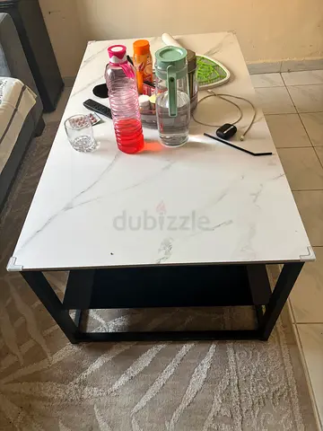 White marble-look coffee table with black metal frame