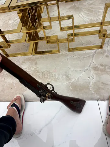 Vintage flintlock-style decorative rifle — solid wood and brass details