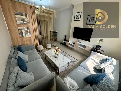 Two bedrooms, two living rooms, maid's room, balcony, and two bathrooms, fully furnished with internet, for monthly rent in Sharjah, Al Taawun area.