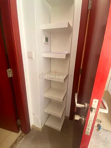 Ikea-style white corner wall shelves - slim tall unit