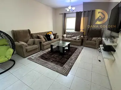 A large room and hall overlooking the main street, a balcony, two large bathrooms, furnished in Sharjah Al Taawun