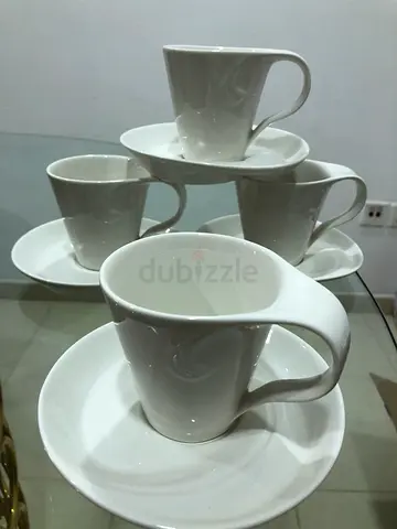 Set of white porcelain coffee cups with saucers - 4 pieces