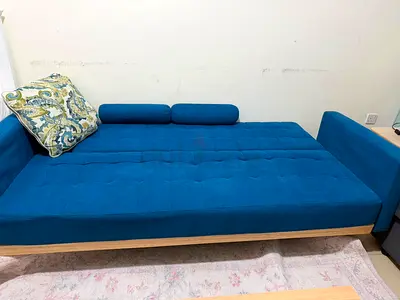 Modern Blue Sofa Bed with Bolster Pillows