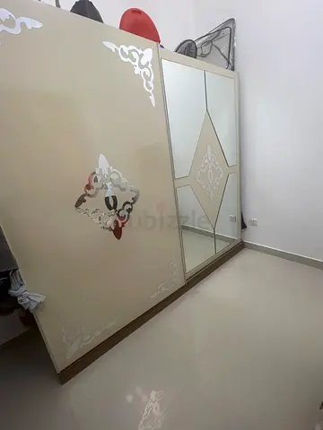 Bedroom golden bed and cupboard furniture