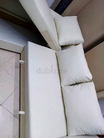 Comfortable Cream Sofa with Three Matching Pillows
