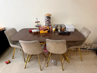 Dining table with 4 upholstered chairs - gold legs
