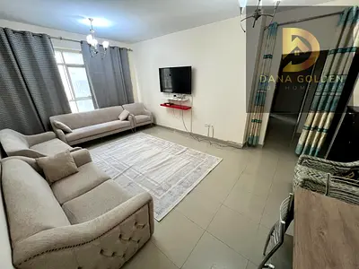 Two bedrooms, a living room, two bathrooms, and a balcony for monthly rent in Sharjah, Al Taawun area.