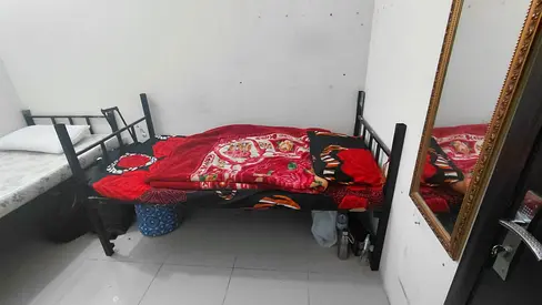 partition room available for two males in New Al zarouni building, Damascus Street, Al Qusais.
