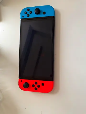 Nintendo Switch OLED console with Neon Joy-Cons - Good working condition