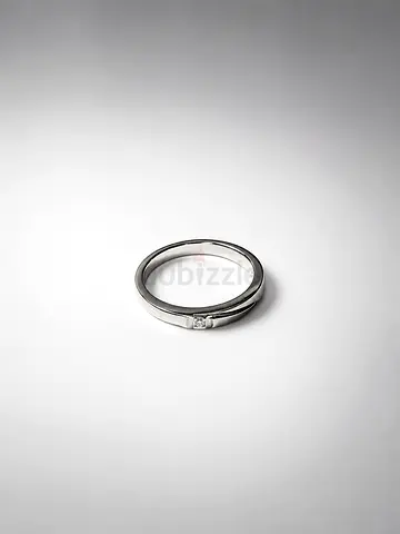 Simple platinum ring with small square setting