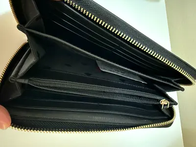 Black zip-around long leather wallet with multiple card slots