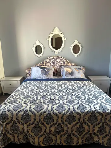 Full bed room set with bed mattress 2 side tables and dresser and above bed mirrors