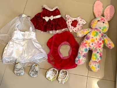 Multi coloured build a bear rabbit with 3 outfits and 2 pair of shoes