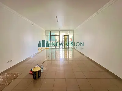 A spacious 2-bedroom apartment in Al Majaz 3 featuring free AC, a master bedroom, built-in wardrobes, and a balcony in a clean family building close t