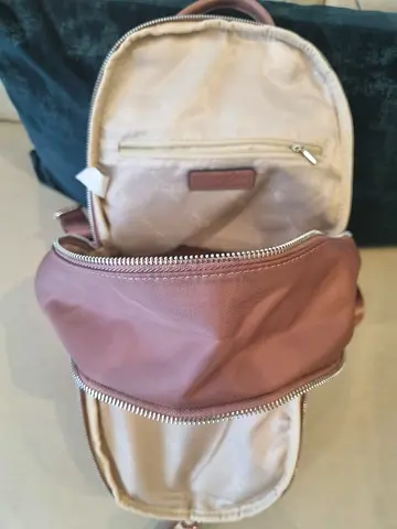 Small dusty-pink backpack — compact everyday bag