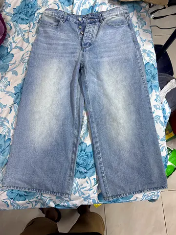 Light blue faded straight-leg baggy jeans, size 34
