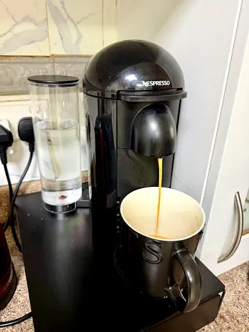 Nespresso Vertuo Capsule Coffee Machine - Good Working Condition with coffee storage stand
