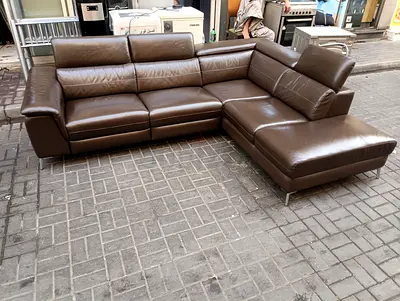 Brown leather L-shaped corner sofa with electric Recliner
