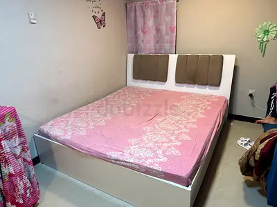 White wooden double bed with storage, padded headboard - good condition