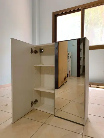 White mirrored bathroom wall cabinet with shelves - good condition. From IKEA.