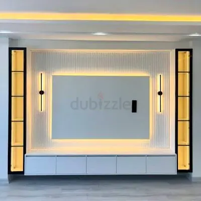 Modern built-in entertainment wall unit with LED lighting and display cabinets