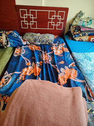 Single wooden headboard with mattress and bedding set (used)