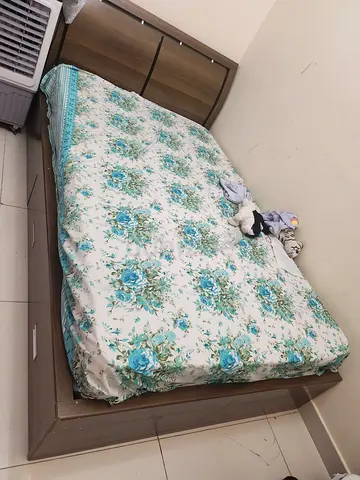 Single wooden bed with storage and headboard, good condition