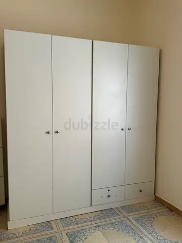 White 4-door Wardrobe / Armoire in good condition