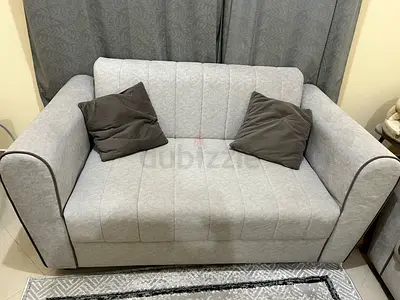 Light grey 2-seater sofa in good condition