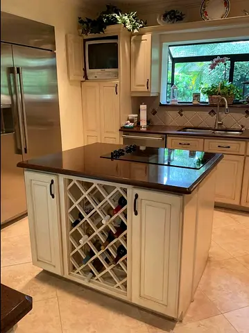 Solid wood kitchen island with wine rack and granite top