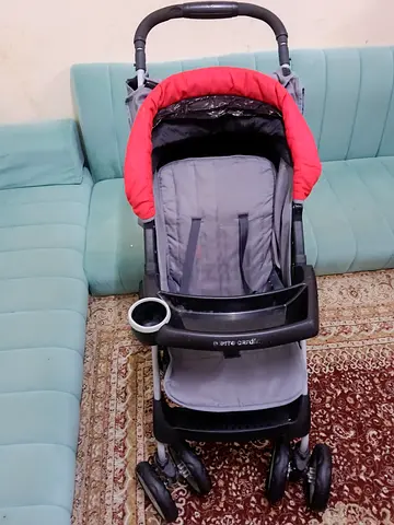 Used lightweight baby stroller with cup holder - excellent condition