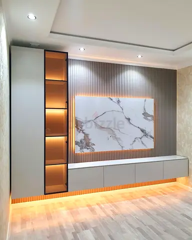 Modern wall-mounted entertainment unit with illuminated display cabinet