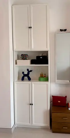 Tall white storage cabinet with shelves and doors - good condition
