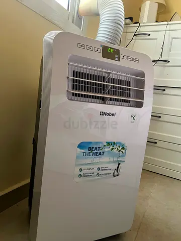 Price reduced! Portable Air Conditioner - 1 ton / 12000 BTU. perfect Condition.. with box, remote