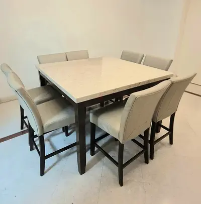 Marble-top square dining table with 8 upholstered chairs