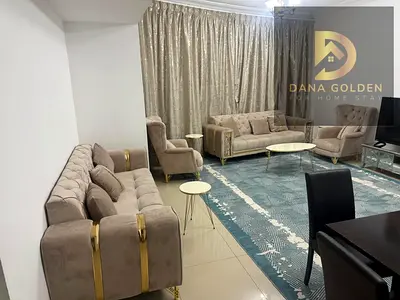 Two bedrooms and a large living room, overlooking the main street and the lake, with a small storage room.