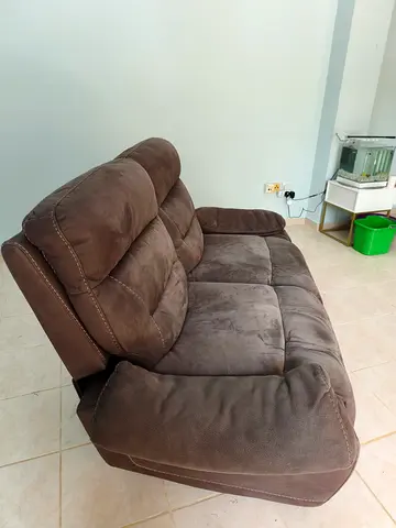 Brown 2-seater reclining sofa - comfortable, recliner is working well, needs minor upholstery repair