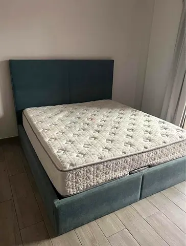 Queen upholstered bed frame with mattress and storage - good condition