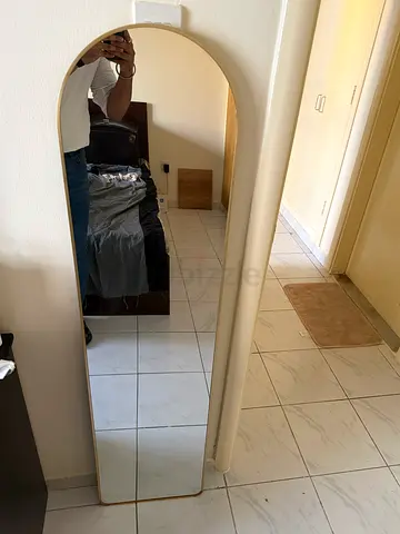 Full-length standing wall mirror with rounded top - good condition