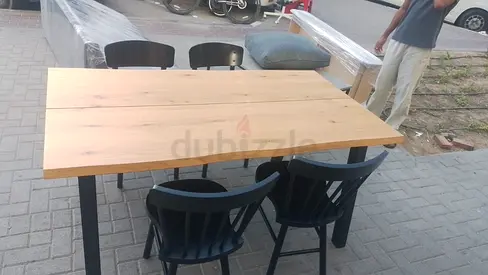 Solid Wood Dining Table with 4 Black Chairs - Good Condition