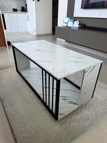Modern marble-look coffee table with black metal frame