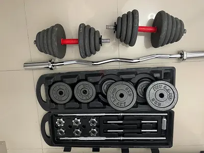 Adjustable Dumbbell Set with Curl Bar and Weight Plates - Good Condition