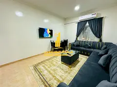 Luxury one-bedroom apartment with a living room and balcony offering an open view. Ajman, Al Muwaiha