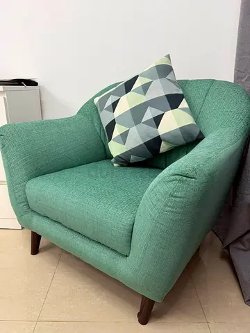 Mint green single-seater armchair with wooden legs