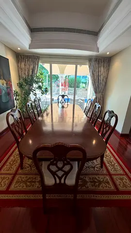 Solid Wood Dining Table with 8 Chairs and Rug - Good Condition